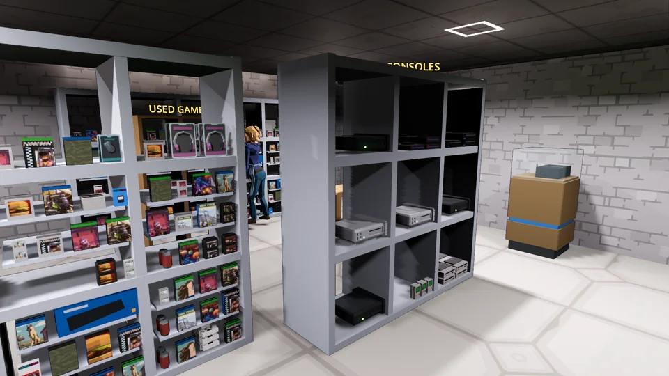 The used games shelf and used console display